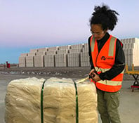 labour worker unpacking shipment