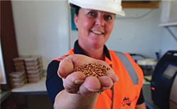 female worker holding grain